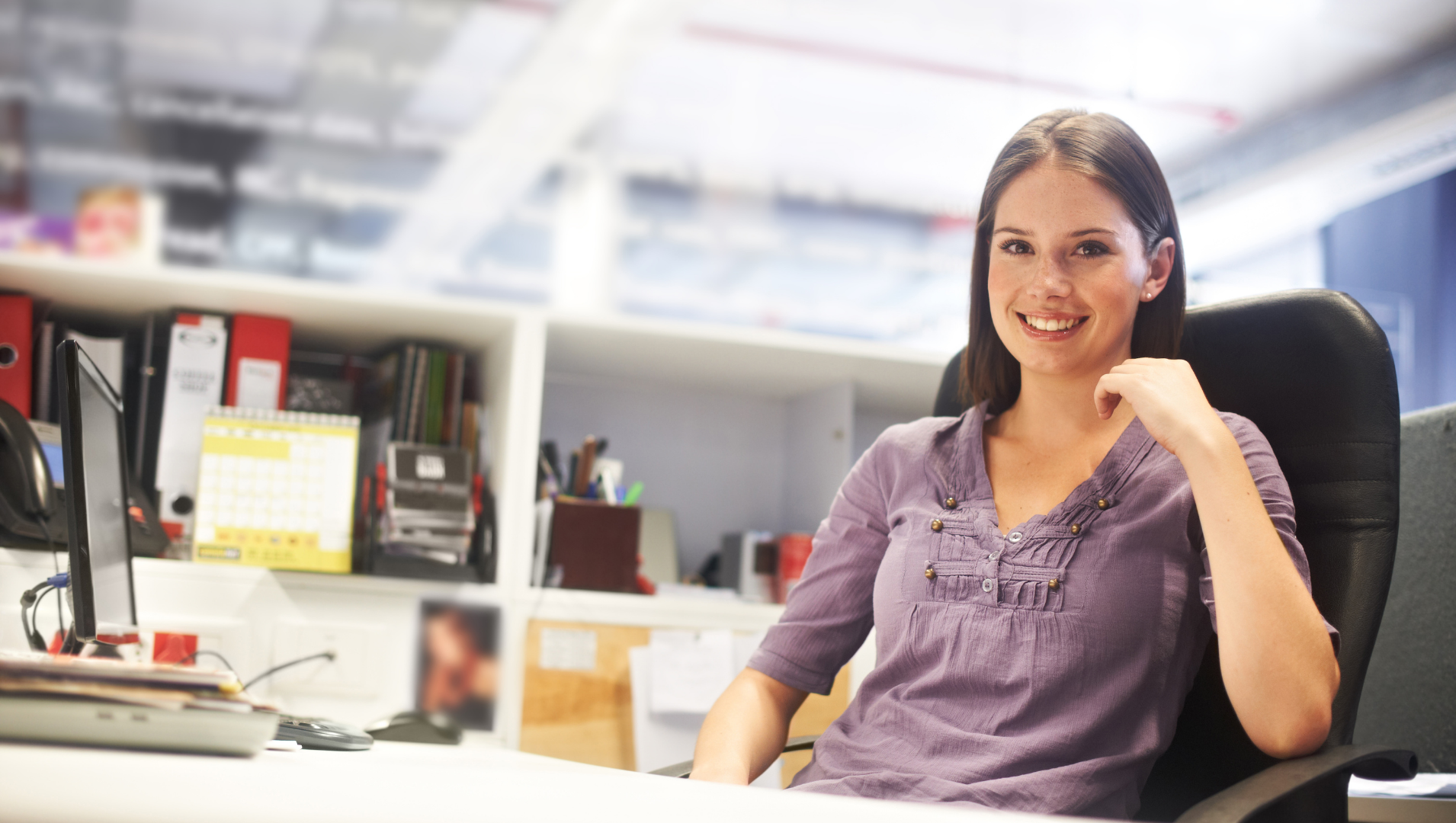 Lady smiling at computer desk