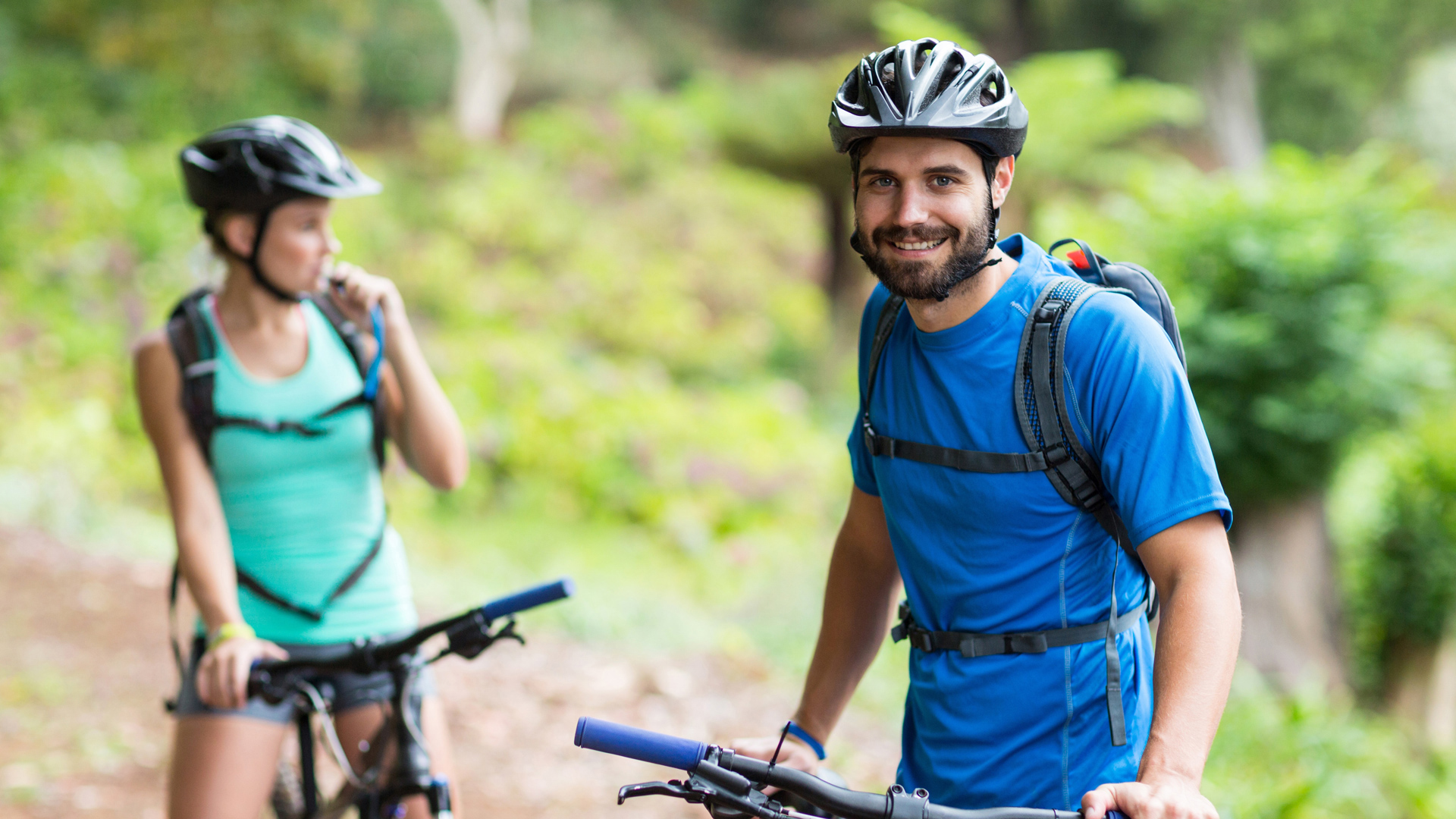 Man smiling with bike helmet
