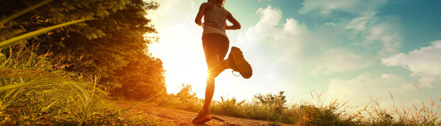 Scenic photo of a runner with a bright sunrise